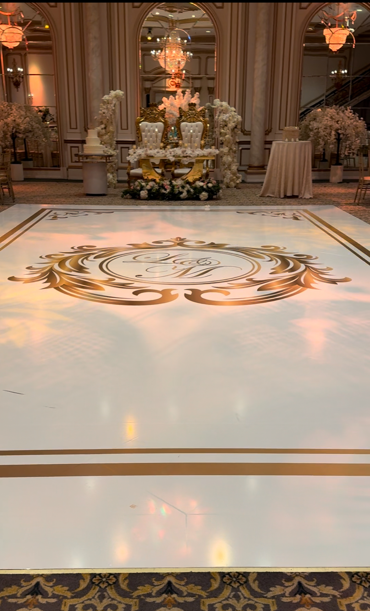 Luxury ballroom with gold monogram dance floor